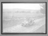 [auto tour driving on country road]