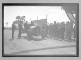 [auto at start-finish line with judges "#8"]