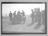 [auto at start-finish line with judges "#8"]