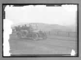 [auto tour driving on country road]