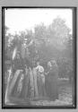 [man on top of wood pile]