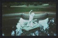 [Fountain statue in pond]