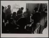 Norman Mailer in sweater in Greenwich Village apartment discusses with writers and artists The Death of the Beat Generation
