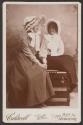 [Two women wearing bonnets]