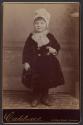 [Girl in winter coat and hat]