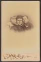 [Woman and two children]