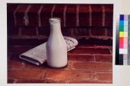 [Diamond Alkali, still life with milk bottle and newspaper]