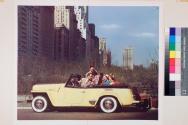 [Willys-Overland, Jeepster with city in background]