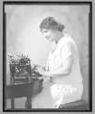 [Helen Keller at braille typewriter]
