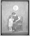 [Helen Keller and a child]
