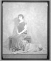 [Helen Keller. seated with large dog]