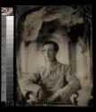 [Young soldier, seated]