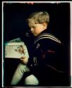 Turner's Boy, seated reading book