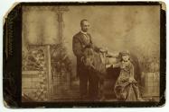 [African American man and white girl with pony]