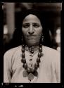 A Syrian arab decorated with amber beads and gold ornaments. Had tattoo marks on chin and hands (A strange custom still persisting) Marks did not photograph.