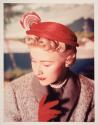 [Woman in red hat]