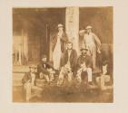 [Group of seven men on steps] \ [Standing man] \ [Group of seventeen men on steps] \ [Group of fourteen men on steps] \ [Seated man]