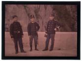 [Three soldiers standing at ease]