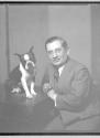 [Man with Boston Bull terrier]