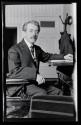 [Joseph Di Nunzio seated at desk]