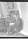Nickolas Muray seated in studio