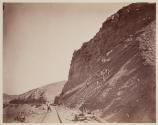 [Men Working on hillside near railroad tracks]