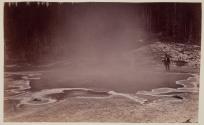 [Figure standing near hot spring]