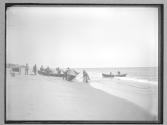 Turning over boat on beach