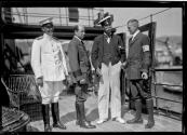 [Sir Thomas Lipton and three other men on deck of yacht]