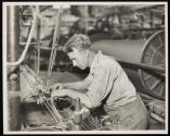 [Textile worker at machine]