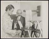 [Woman textile worker with inspector]