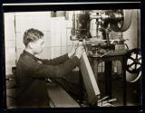 Boy making paper boxes