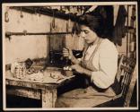 [Young Italian girl making artifical roses]