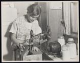 [Housewife with mixer driven by electric motor]