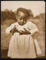 [Small black child]