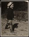 [Child in boots]