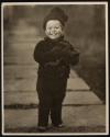 [Child with doll]