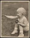 [Portrait of baby playing in yard]