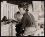 [Child at work with hammer]