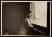 [Child by window]