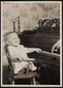 [Portrait of baby at piano]