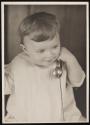 [Portrait of child with toy telephone]