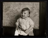 [Portrait of child with comb]