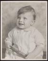 [Portrait of child with comb]