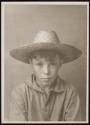 [Portrait of boy in straw hat]