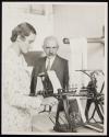 [Woman textile worker with inspector]