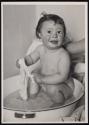 [Baby taking bath]