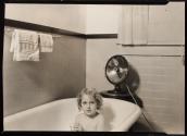 [Young girl in bathtub]