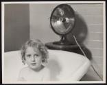 [Young girl in bathtub]