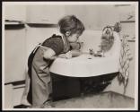 [Girl playing in sink]